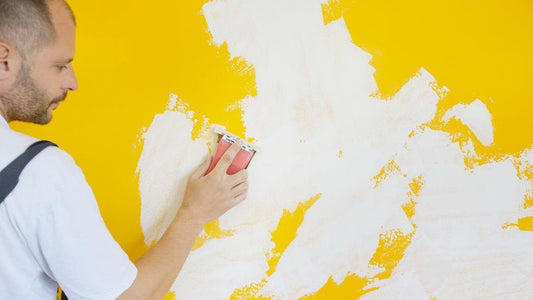 Sand the drywall using dust-free sandpaper
